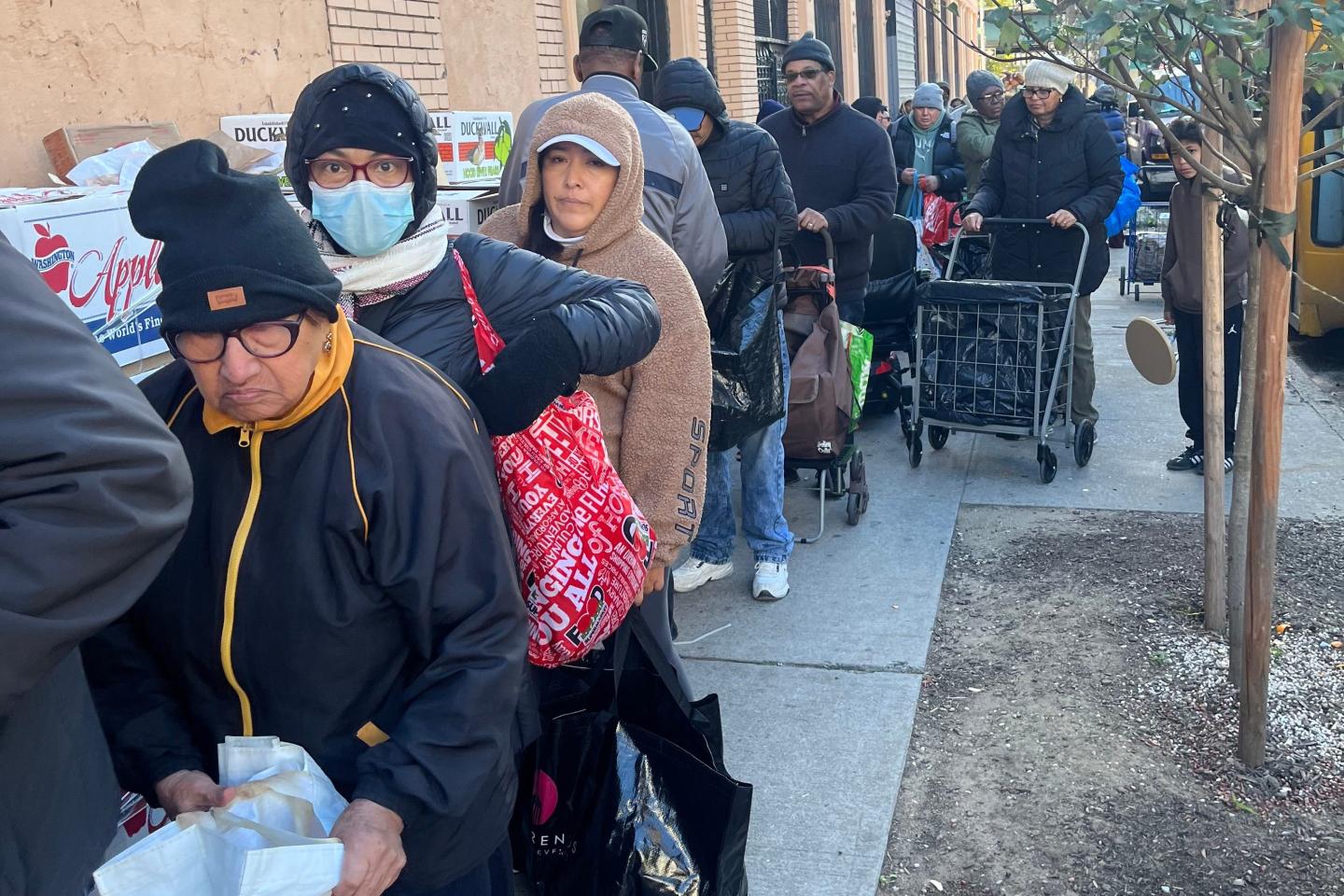 Long lines form at food pantries after SNAP payments were suddenly cut off due to the government shutdown