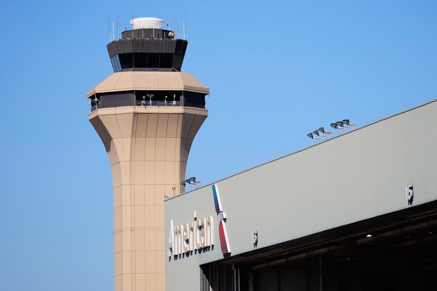 A control tower by an American Airlines hangar is shown at Dallas Fort Worth International Airport on Oct. 15.