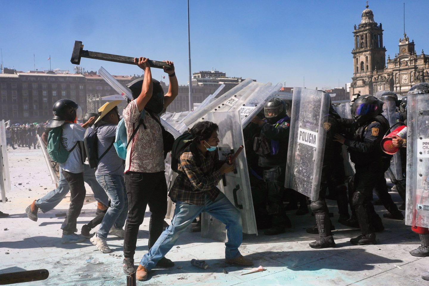 Protesters charge at police during a youth anti-government march in Mexico City, Saturday, Nov. 15, 2025. (AP Photo/Marco Ugarte)
