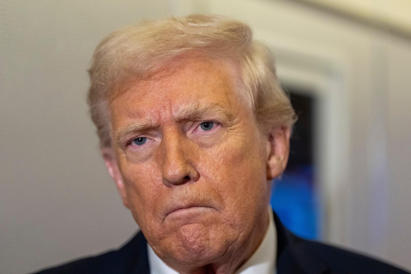 A close-up of Donald Trump scowling