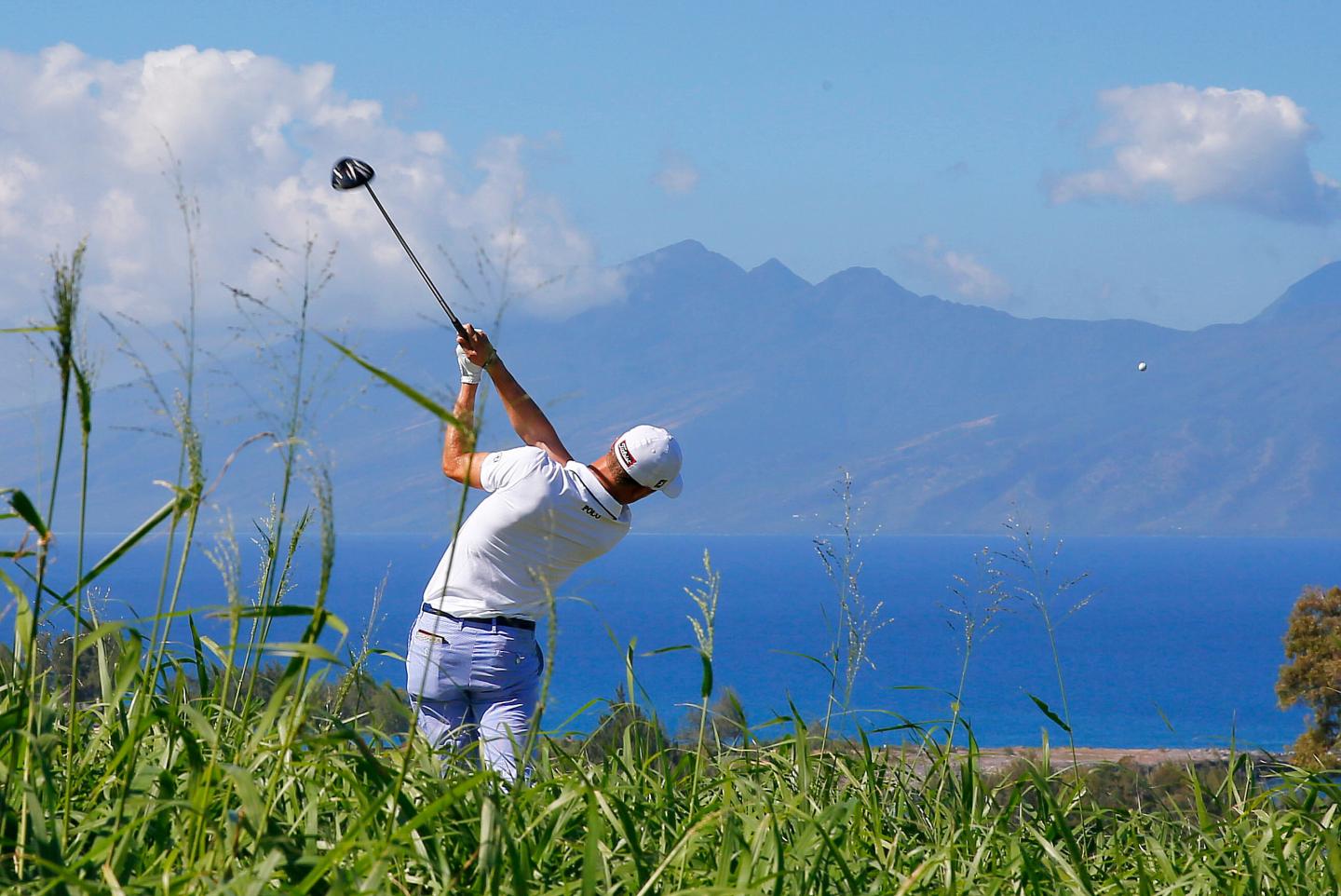 Justin Thomas hits from the seventh tee during the first round of the Tournament of Champions golf tournament at Kapalua Plantation Course on Kapalua, Hawaii in January 2016.
