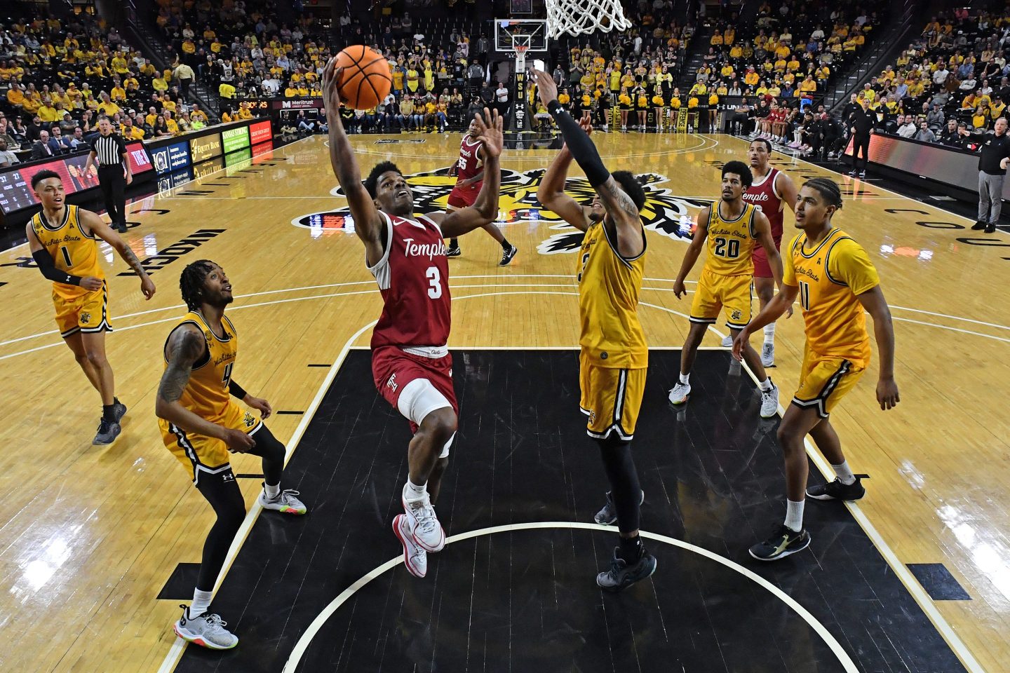 Hysier Miller #3 of the Temple Owls goes to the basket for a layup against Ronnie DeGray III #3 of the Wichita State Shockers in the first half at Charles Koch Arena on February 25, 2024 in Wichita, Kansas.