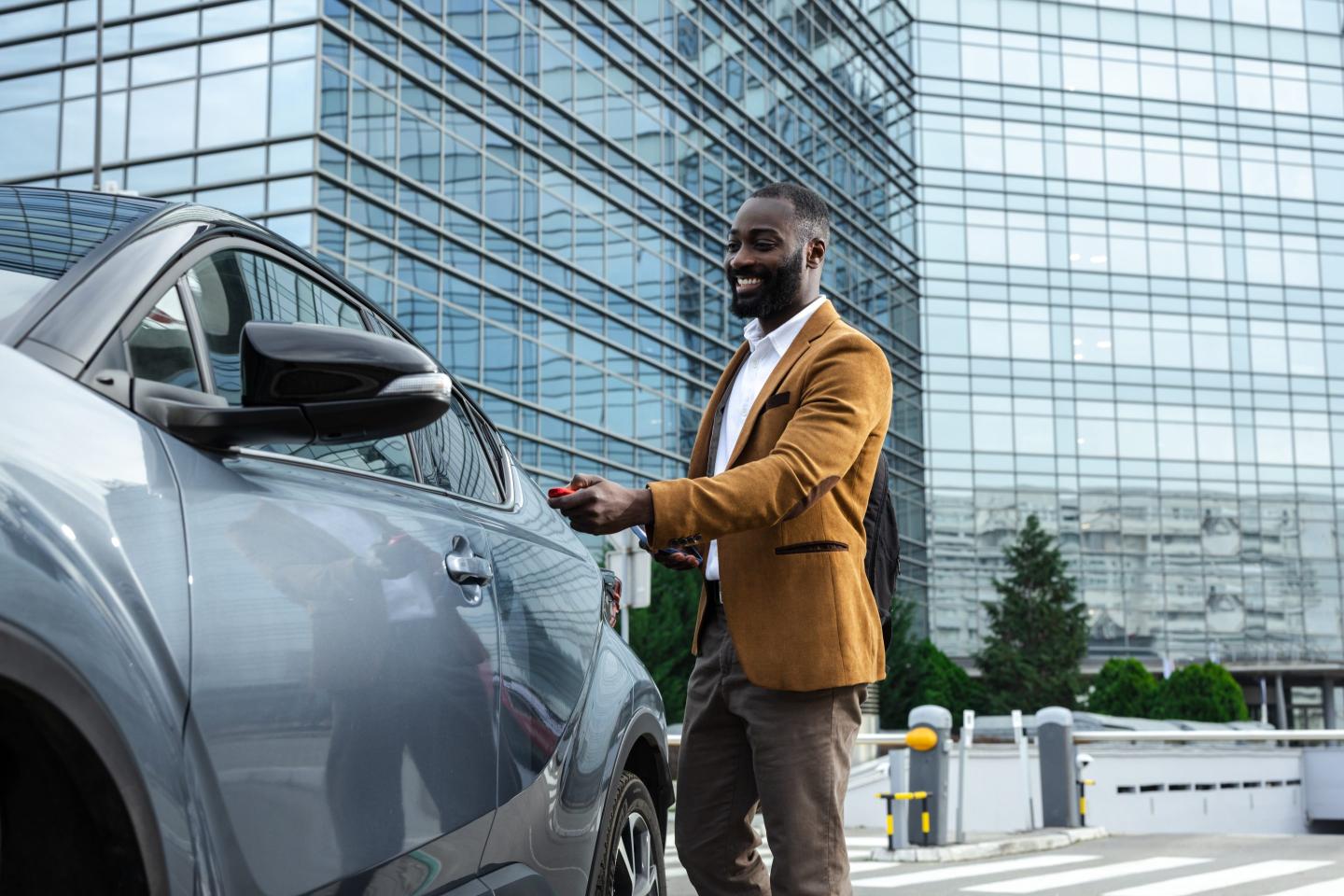 Man walking to car in city