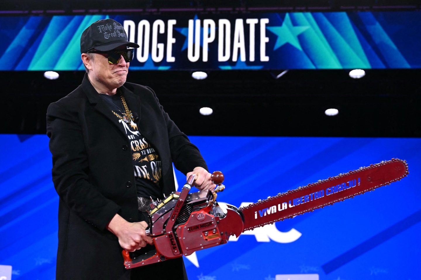 Elon Musk holds a chainsaw during the annual Conservative Political Action Conference in Oxon Hill, Md., on Feb. 20, 2025.