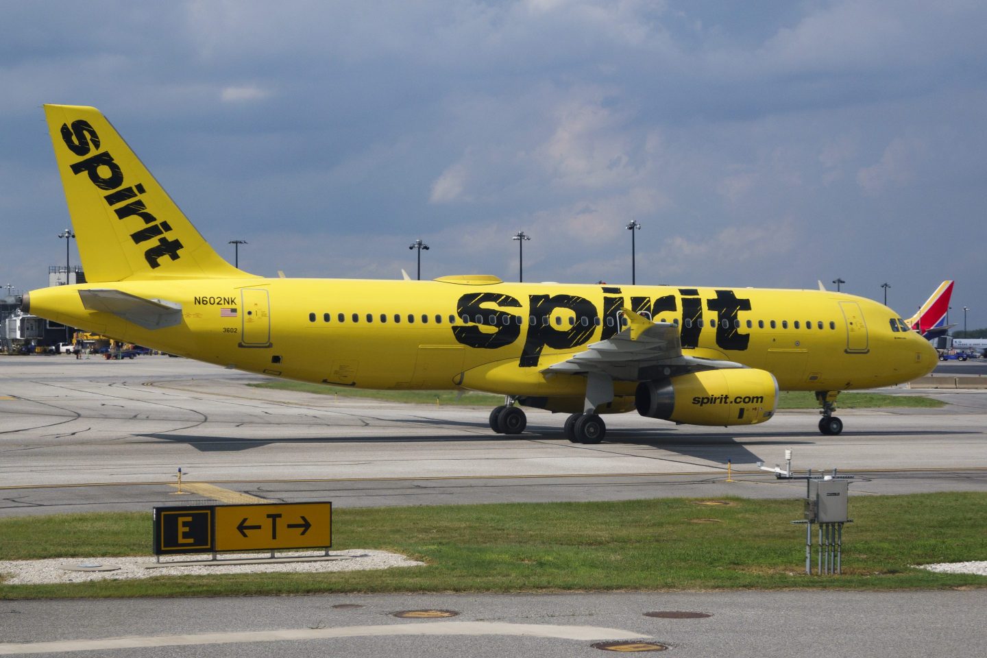 A Spirit Airlines plane sitting on the runway