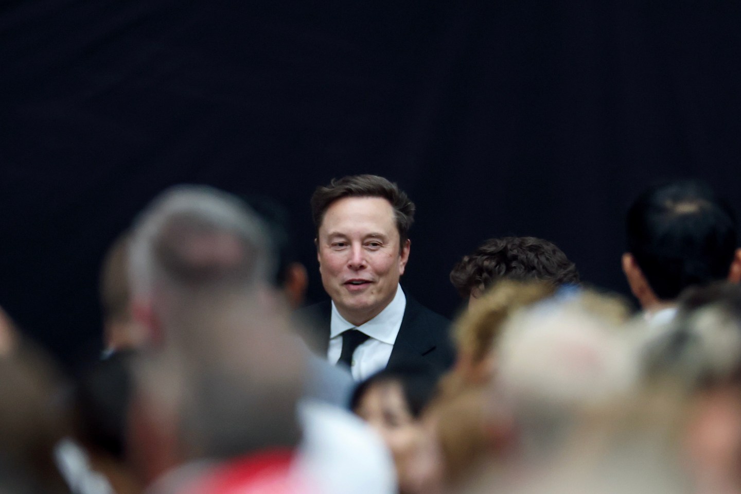 esla CEO Elon Musk attends the memorial service for political activist Charlie Kirk at State Farm Stadium on September 21, 2025 in Glendale, Ariz.