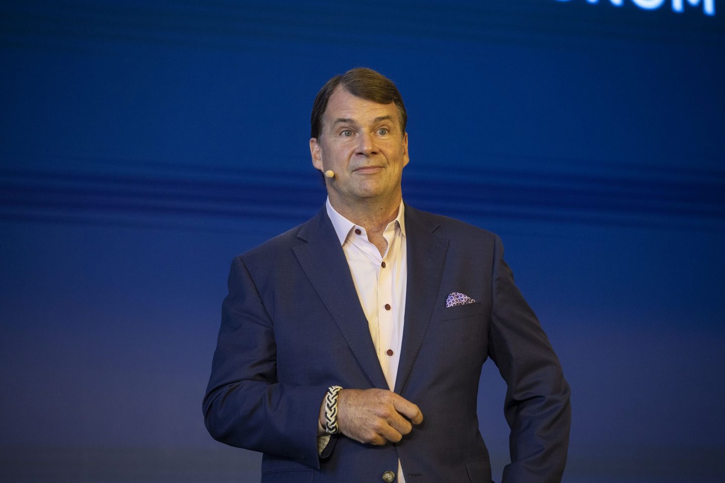 Jim Farley stands on stage