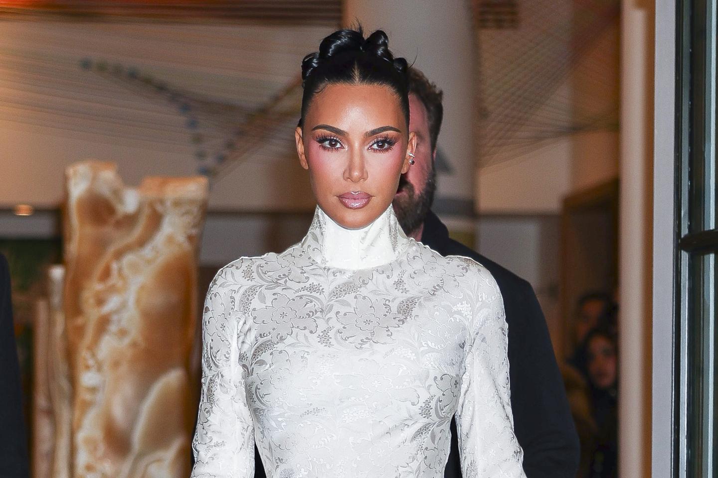Kim Kardashian wears a bedazzled white dress