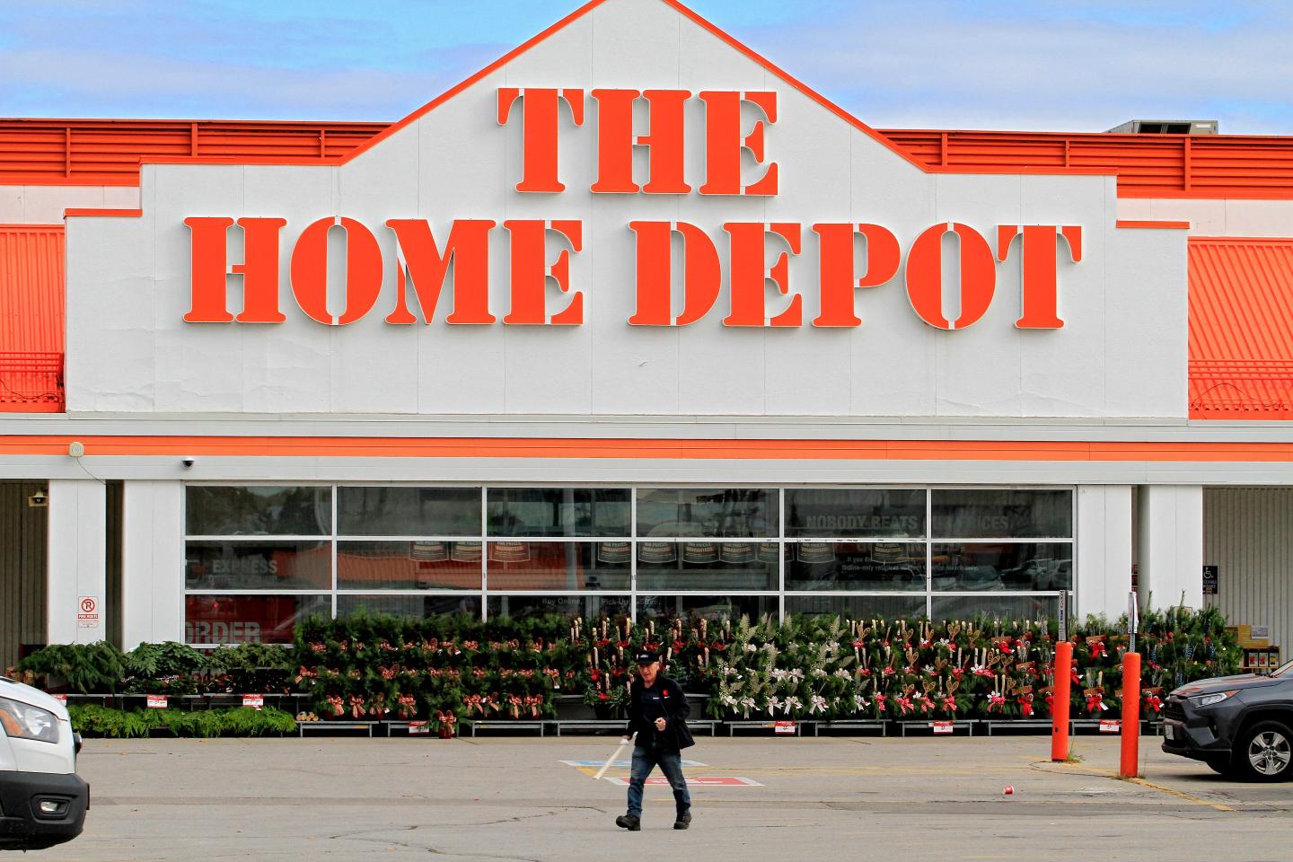 A man walks outside of a Home Depot