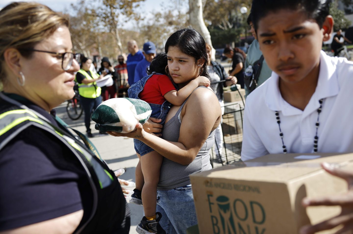People receive free food boxes at a large-scale food distribution, in response to the federal government shutdown and SNAP/CalFresh food benefits delays, on November 11, 2025 in Los Angeles, California. The event was hosted by the Los Angeles Regional Food Bank and the office of L.A. County Supervisor Holly Mitchell.