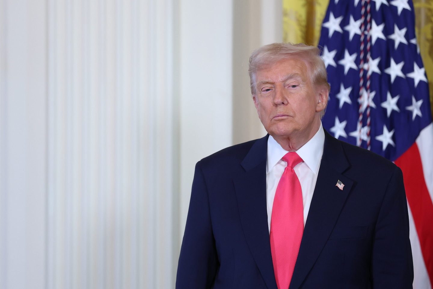 President Donald Trump listens as first lady Melania Trump speaks at a signing ceremony for the "Fostering the Future" executive order in the East Room of the White House on November 13, 2025 in Washington, DC.