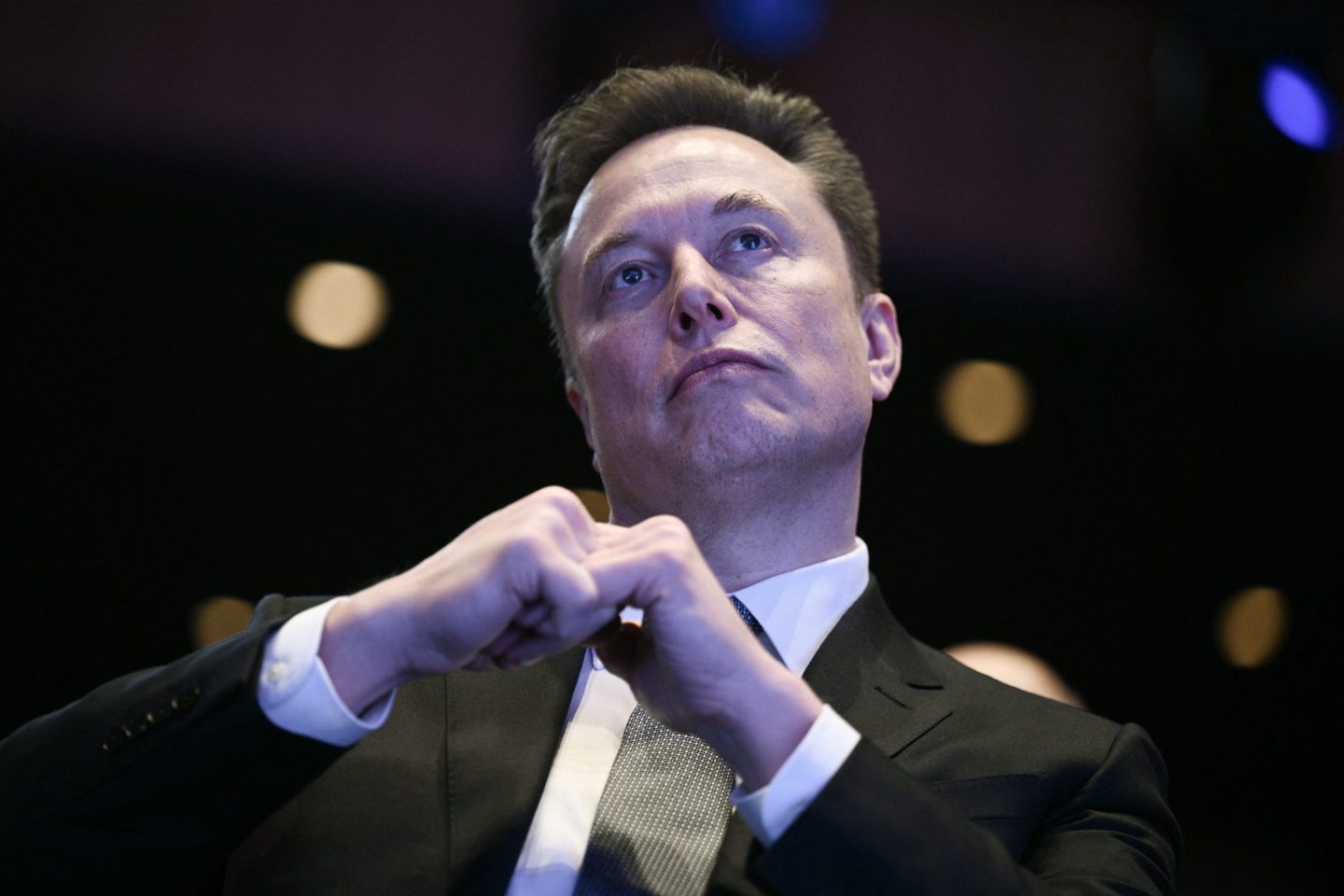 Elon Musk looks on as US President Donald Trump speaks at the US-Saudi Investment Forum at the John F. Kennedy Center for the Performing Arts in Washington, DC on November 19, 2025.