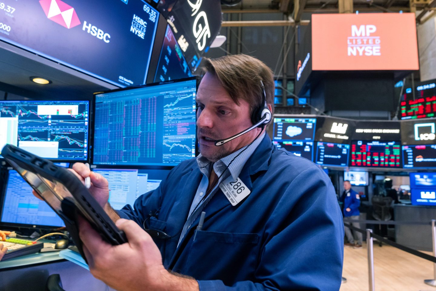 Traders work as the market opens on the floor of the New York Stock Exchange (NYSE) on November 18, 2025 in New York City.