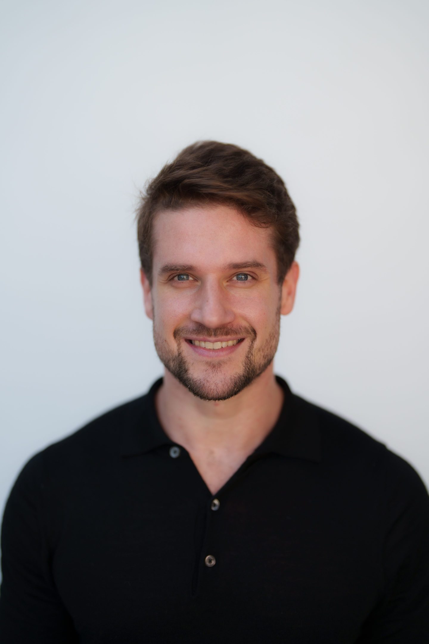 man smiles to camera