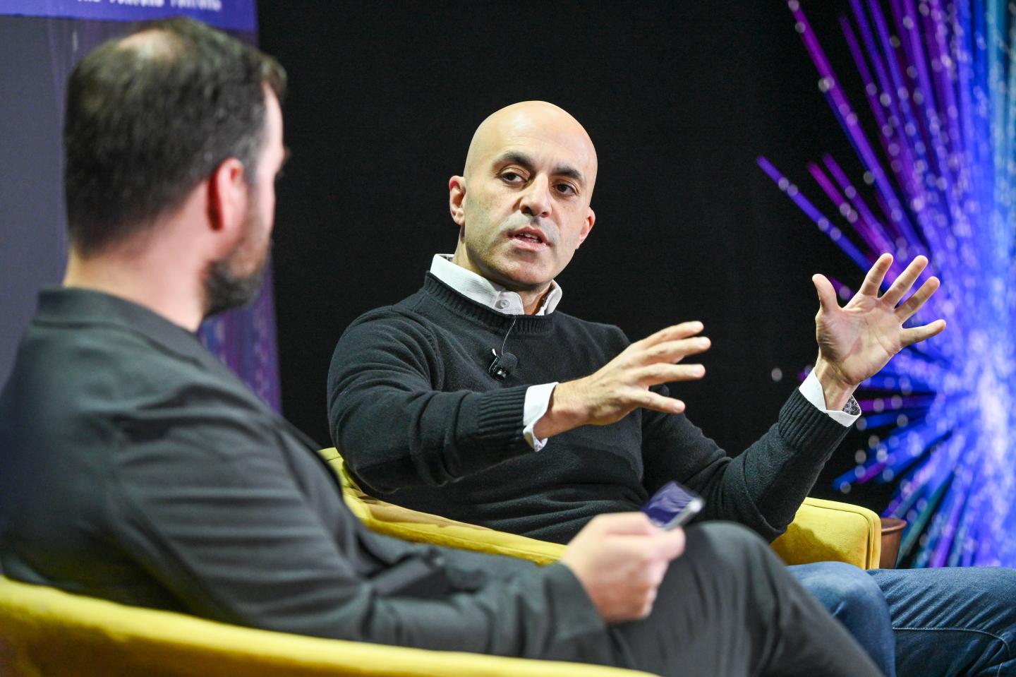 Databricks CEO speaking on stage.