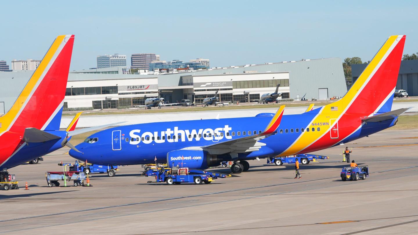 A Southwest Airlines jet pulls into a gate at Dallas Love Field Airport Tuesday, Nov. 11, 2025.