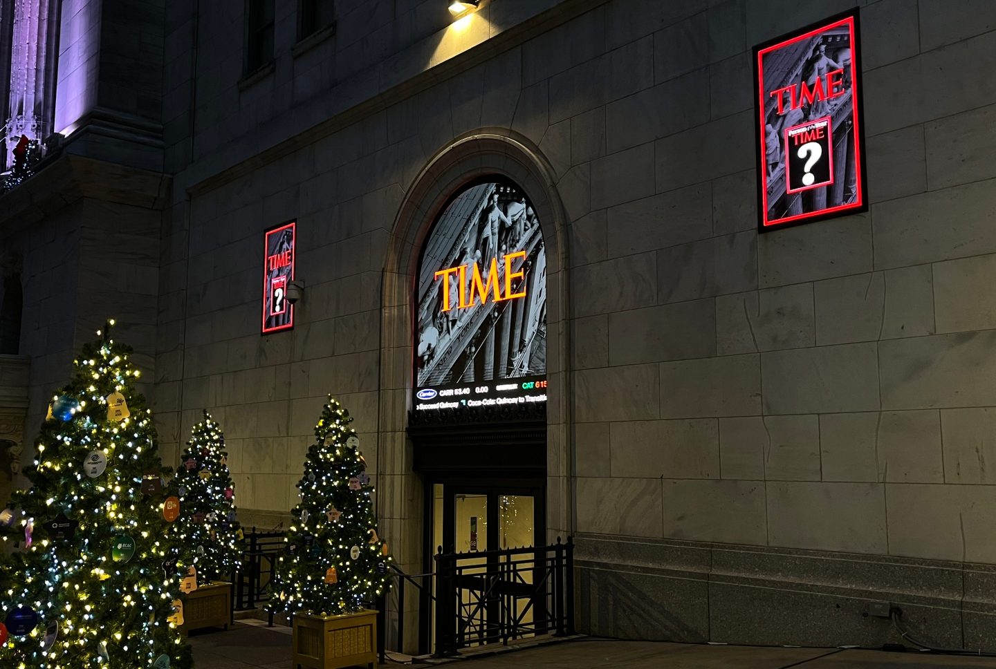 A sign for Time magazine is displayed outside the New York Stock Exchange on Thursday, Dec. 11, 2025 in New York.