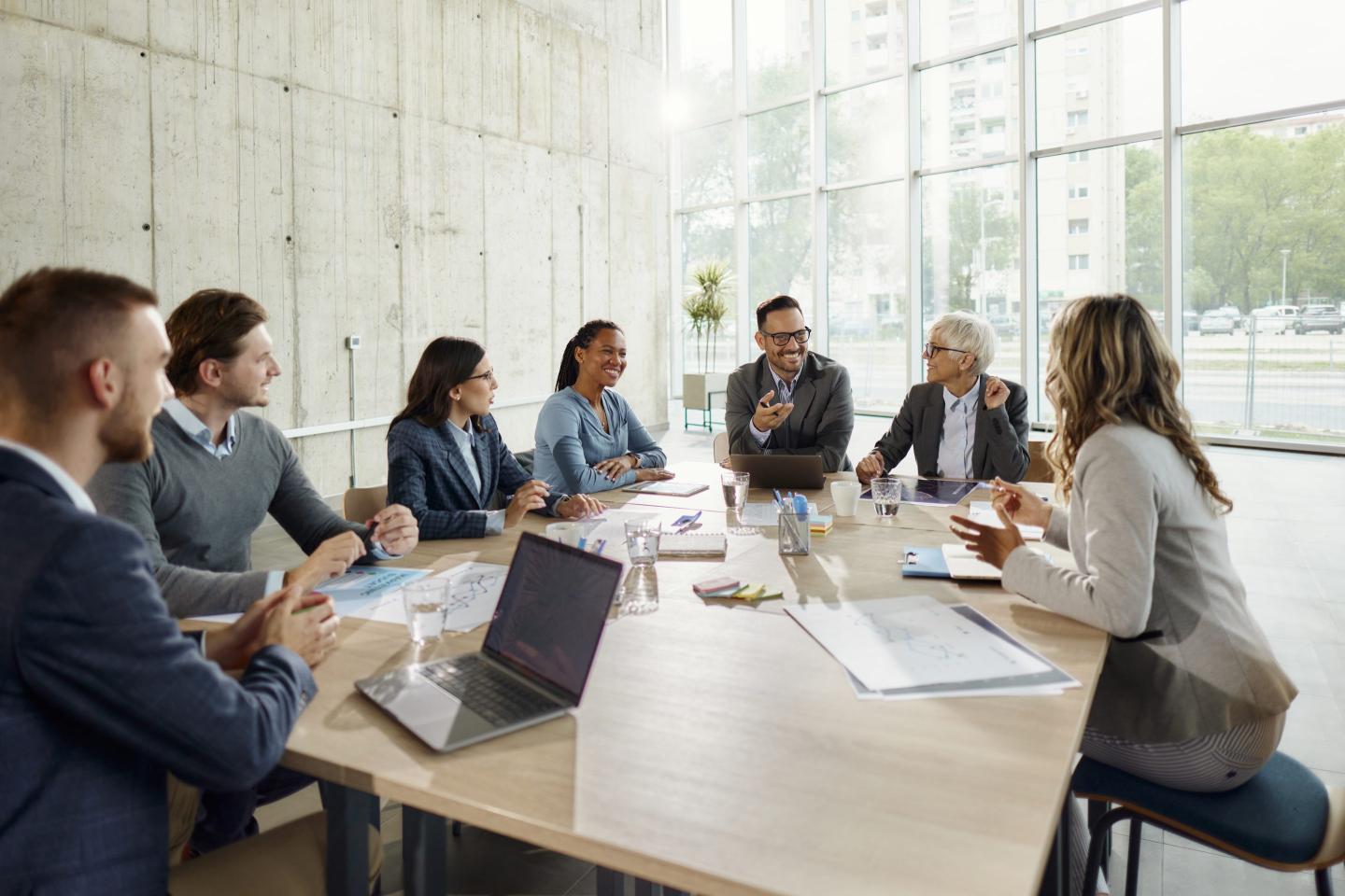 Team of executives talking in a meeting in the office.