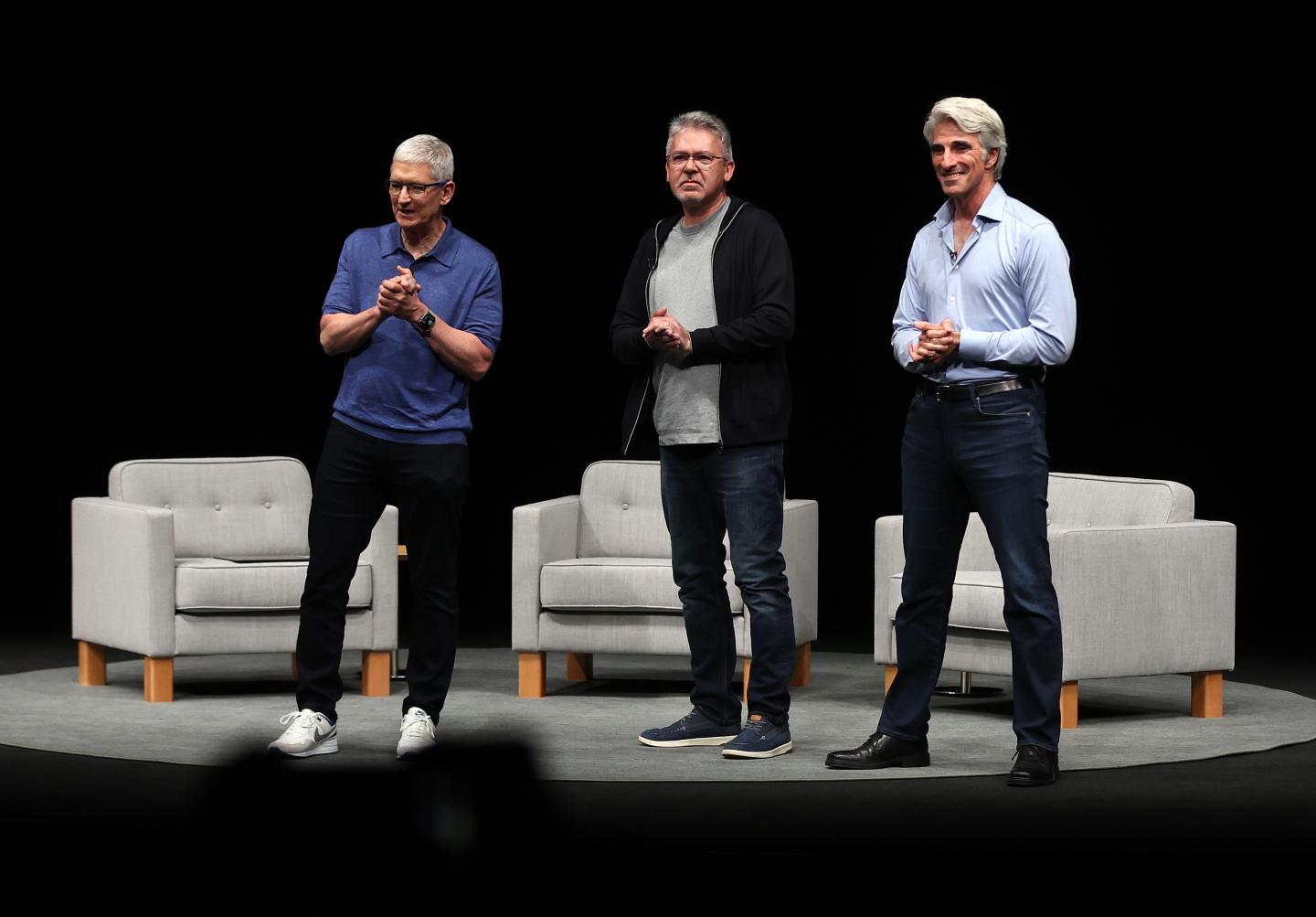 Apple CEO Tim Cook (left), Apple SVP of machine learning and AI strategy John Giannandrea (center), and Apple SVP of software engineering Craig Federighi on June 10, 2024 in Cupertino, California. (Photo: Justin Sullivan/Getty Images)