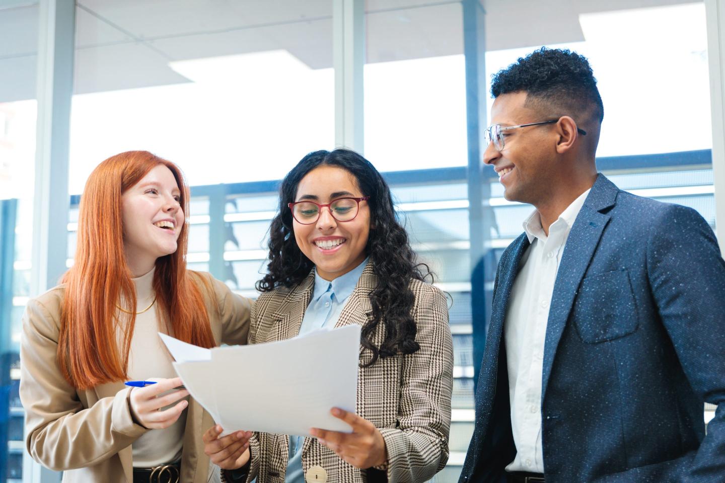 Gen Z workers collaborate in the office.