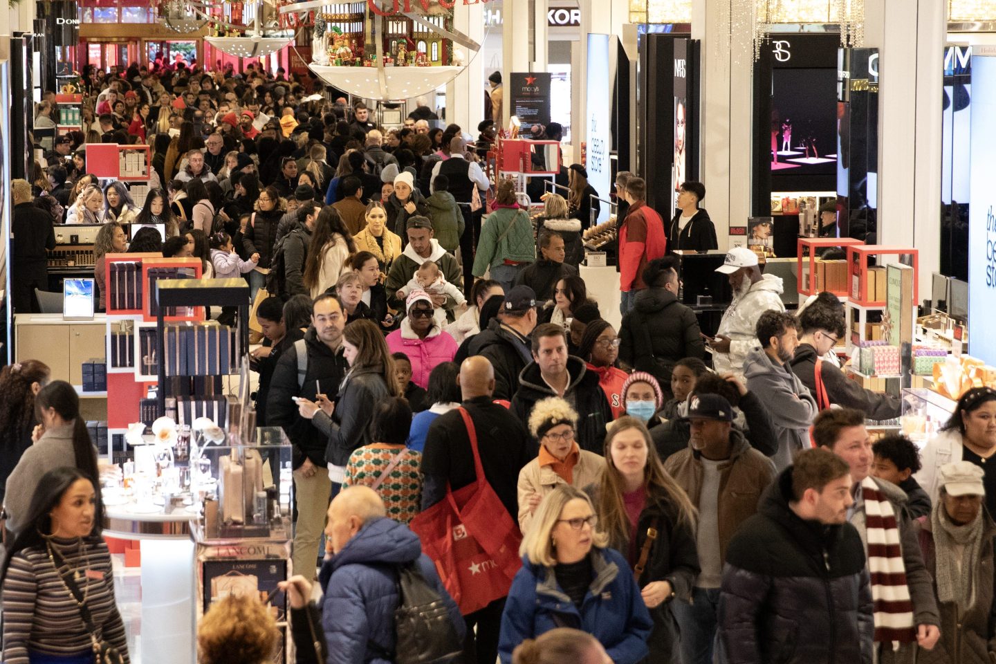 Customers shop at a department store of Macy's on Black Friday on November 29, 2024 in New York City.
