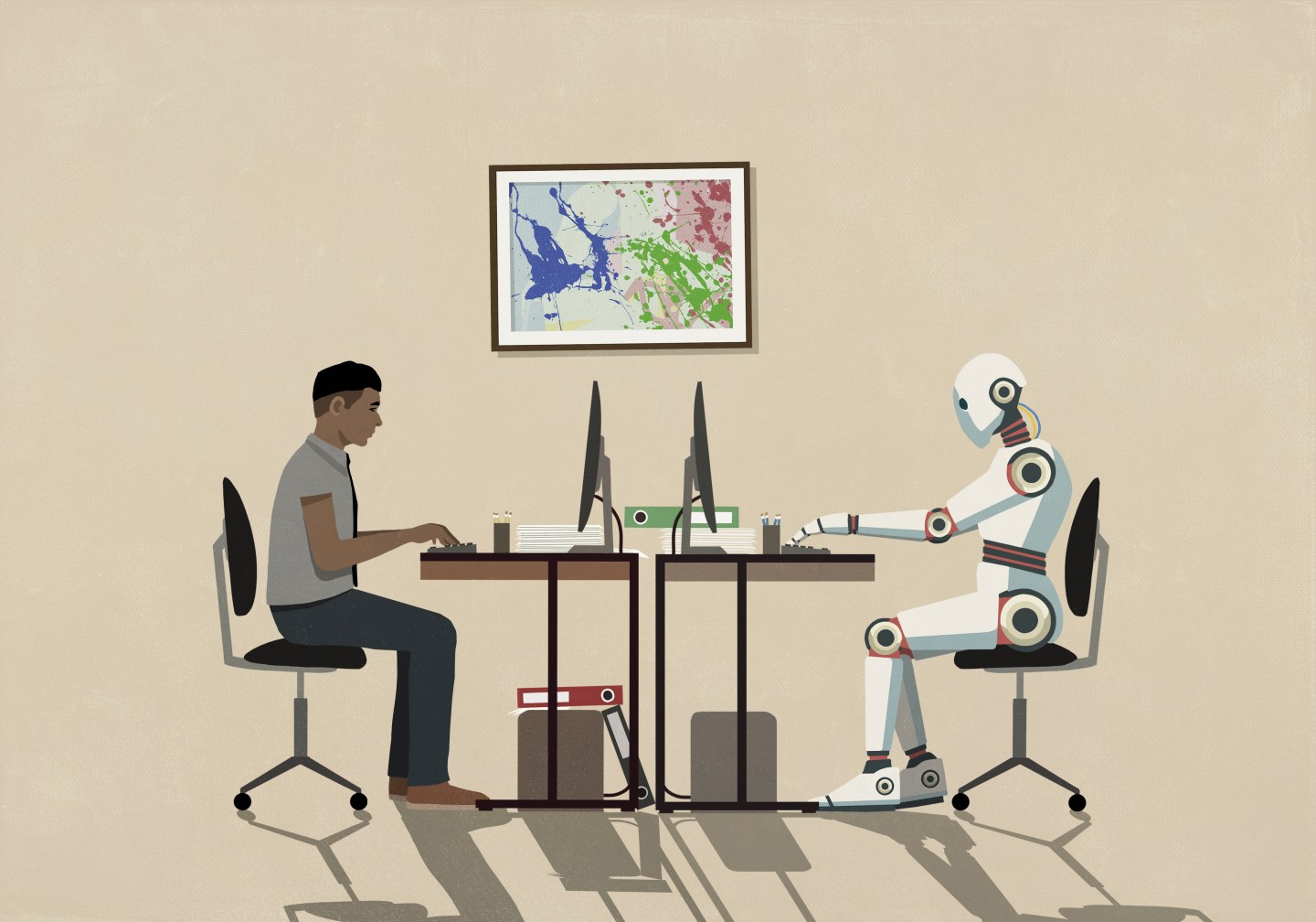 A man and robot sitting opposite each other.