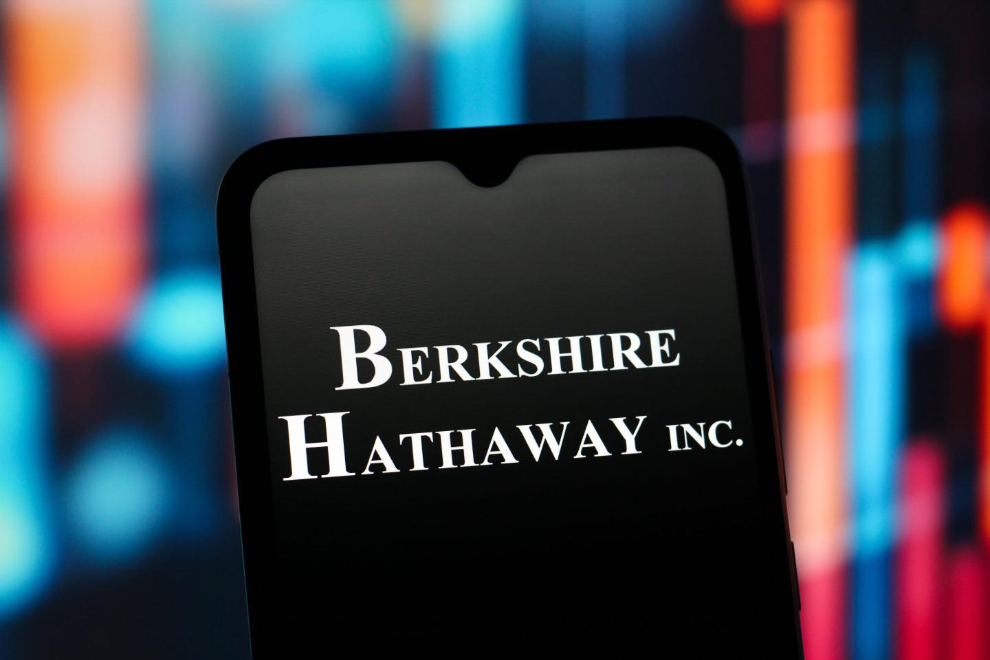 Berkshire Hathaway logo is seen displayed on a smartphone screen.