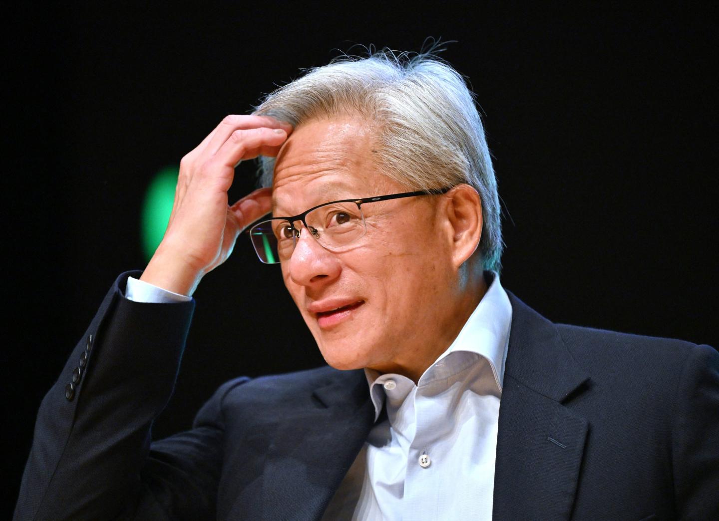 Nvidia founder and CEO Jensen Huang reacts during a press conference at the Asia-Pacific Economic Cooperation (APEC) CEO Summit in Gyeongju on October 31, 2025.