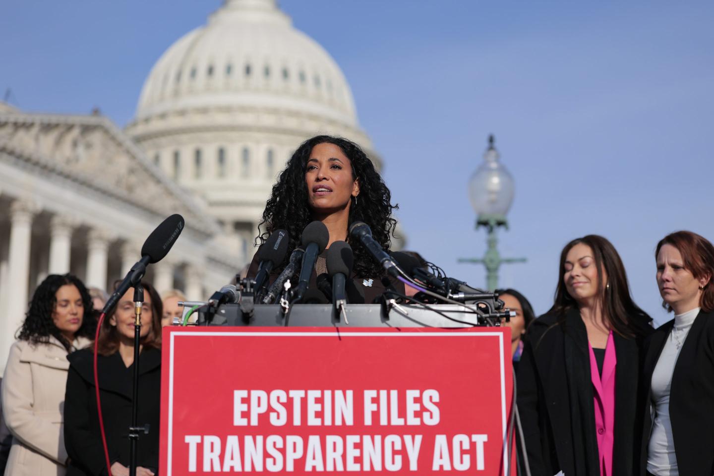 Epstein abuse survivor Lisa Phillips speaks during a news conference with lawmakers.