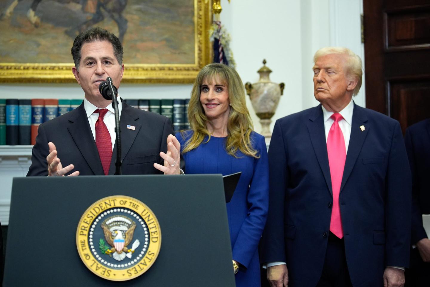 Michael Dell, chairman and chief executive officer of Dell Inc., from left, his wife Susan Dell, and US President Donald Trump during an announcement on "Trump Accounts" for children in the Roosevelt Room of the White House in Washington, DC, US, on Tuesday, Dec. 2, 2025.