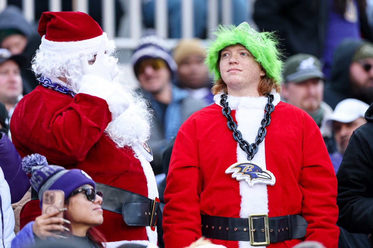 BALTIMORE, MD - DECEMBER 07: Baltimore Ravens fans look on while wearing Santa and Grinch costumes during the first half of the game between the Baltimore Ravens and the Pittsburgh Steelers at M&T Bank Stadium on December 7, 2025 in Baltimore, Maryland. (Photo by Scott Taetsch/Getty Images)