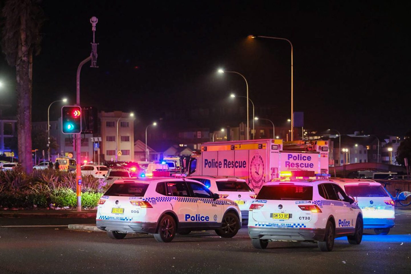 SYDNEY, AUSTRALIA - DECEMBER 14: Police cars are seen parked at at the scene of a mass shooting at Bondi Beach on December 14, 2025 in Sydney, Australia. Two gunmen dressed in black fired several shots at Sydney's world-famous Bondi Beach, causing at least 10 injuries and three deaths, and setting off mass panic on a Sunday evening. (Photo by George Chan/Getty Images)
