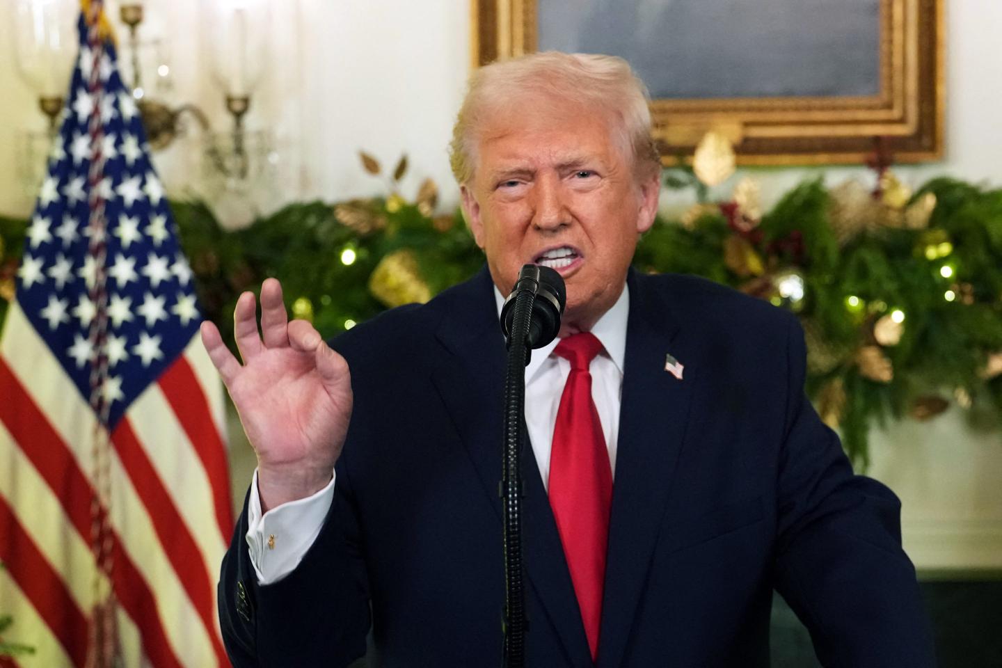 Trump gives an OK sign while giving a speech in the White House