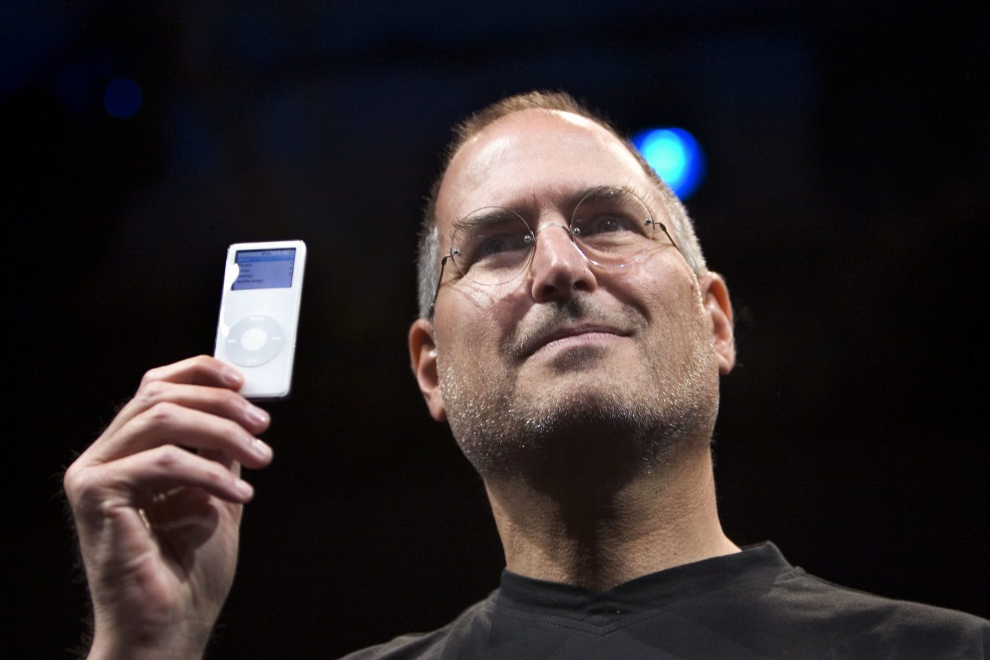 Steve Jobs holds up the first iPod Nano
