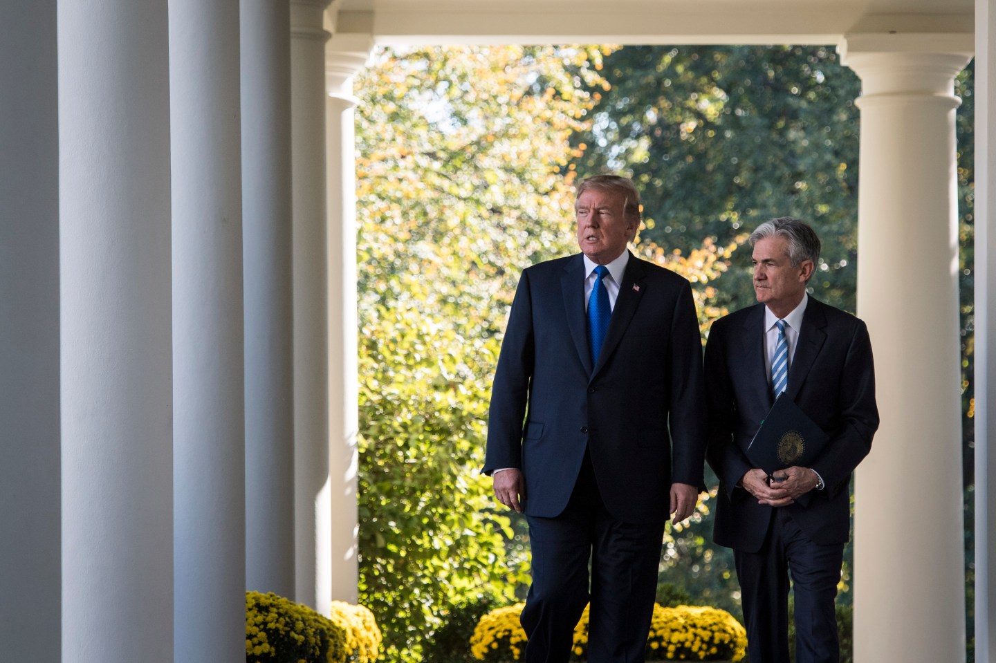 President Donald Trump walks out with Federal Reserve board member Jerome Powell
