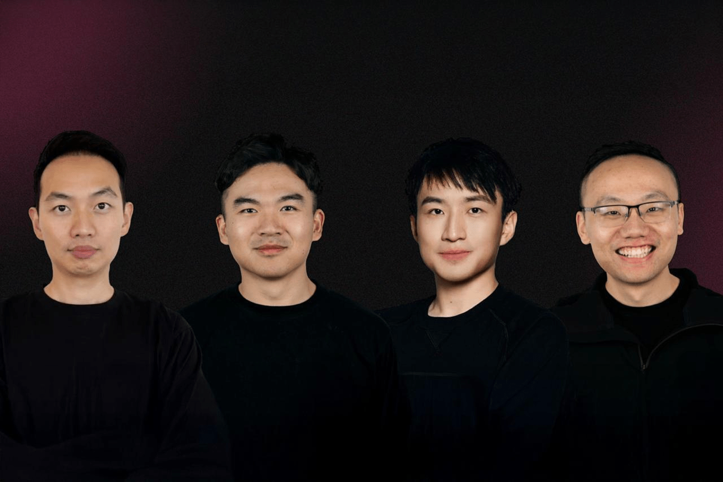 Four men pose for photo