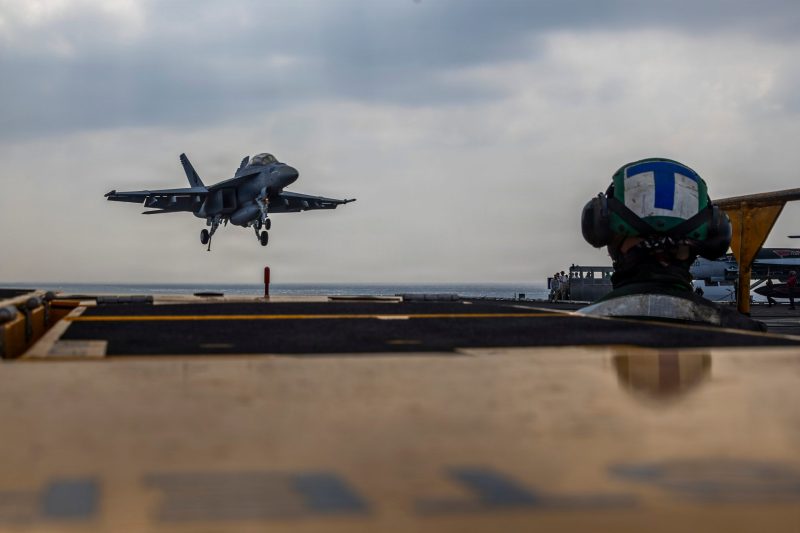 Carrier strike group with stealth fighters arrives in Mideast as Trump weighs Iran attack while Air Force jets and cargo planes also head to region