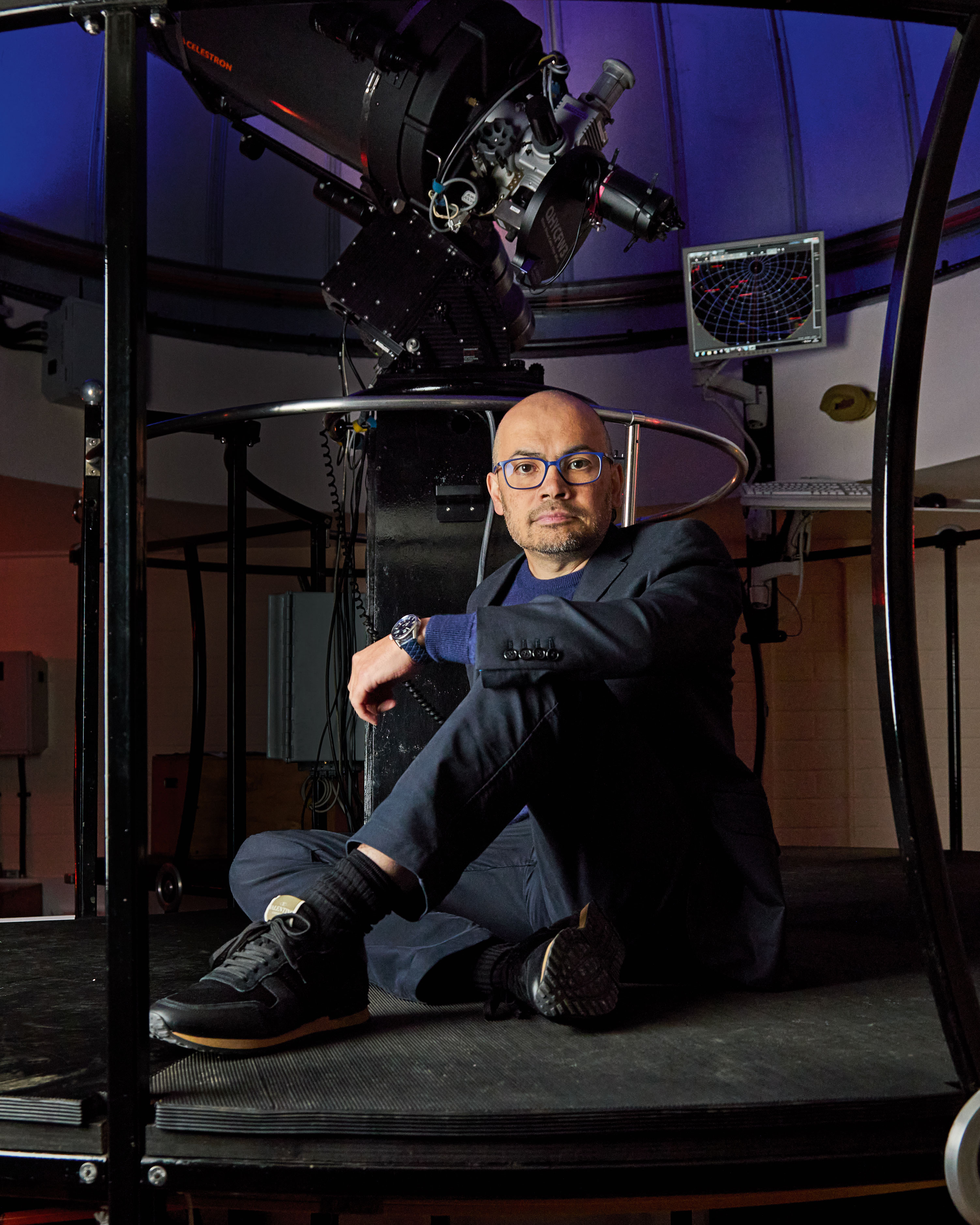 Demis Hassabis in front of the Fry Telescope
at the UCL (University College London) Observatory.