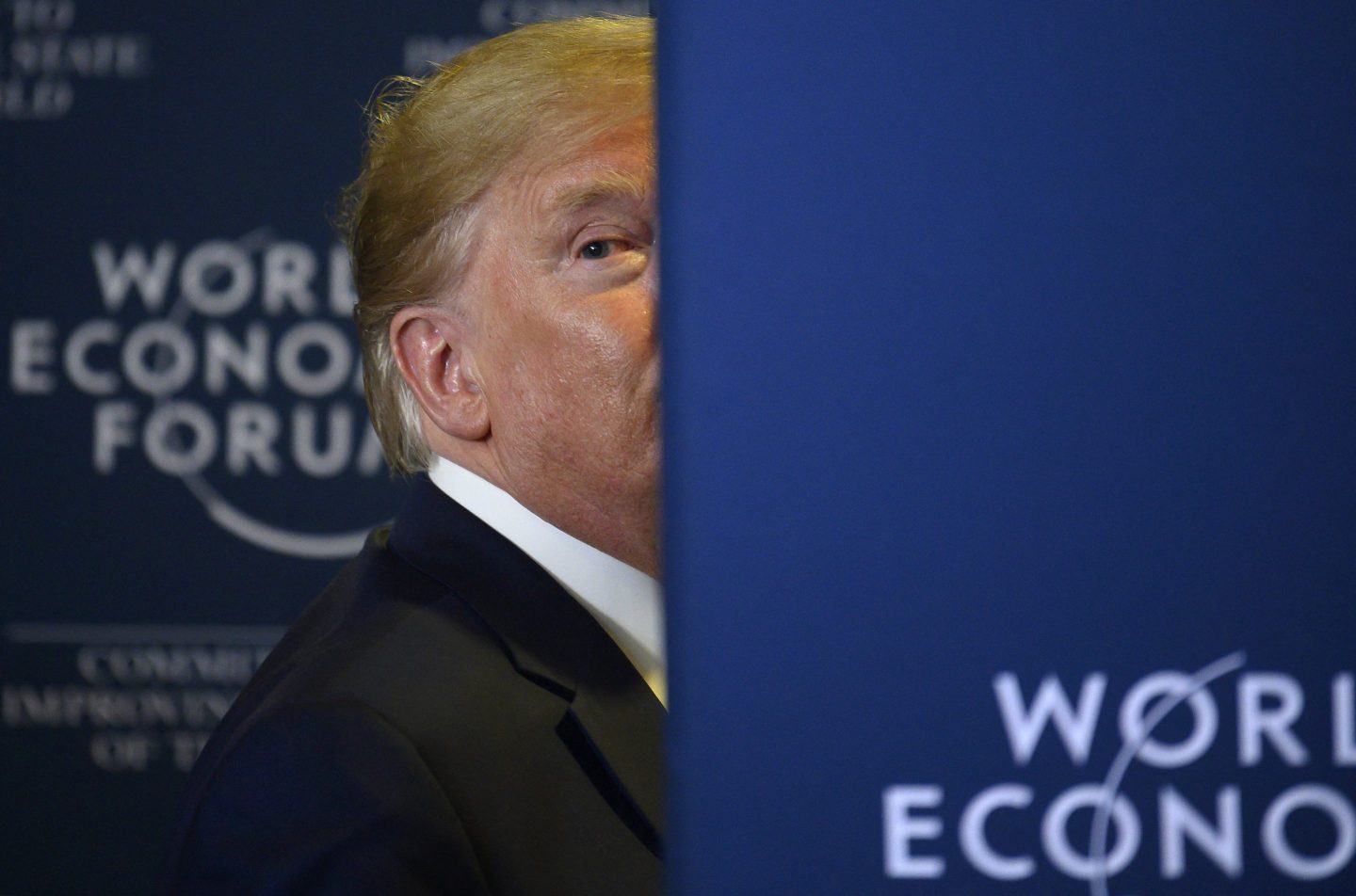 US President Donald Trump looks back as a question from the press is shouted after a press conference at the World Economic Forum in Davos, Switzerland, on January 22, 2020.