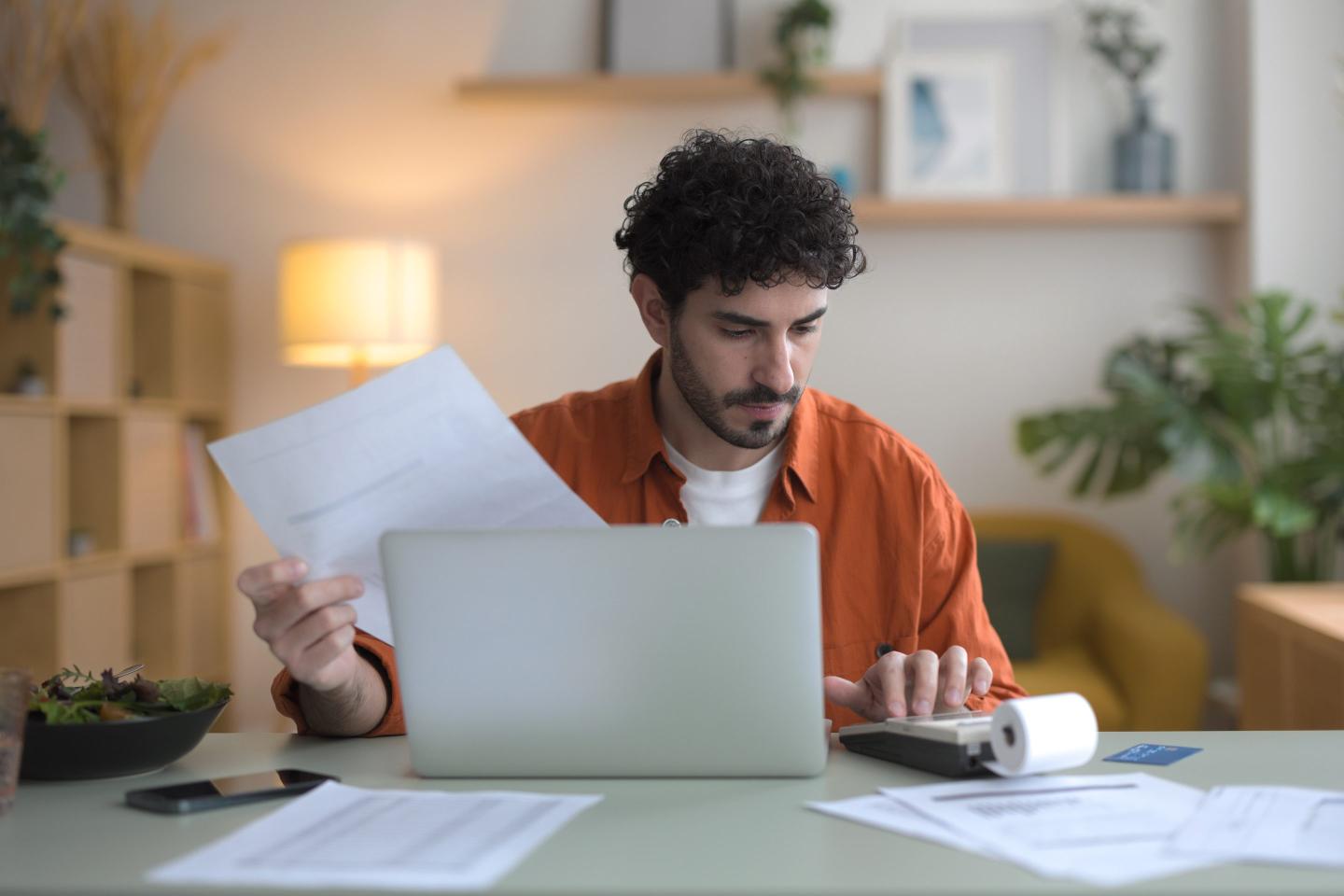 Man at his laptop working on taxes