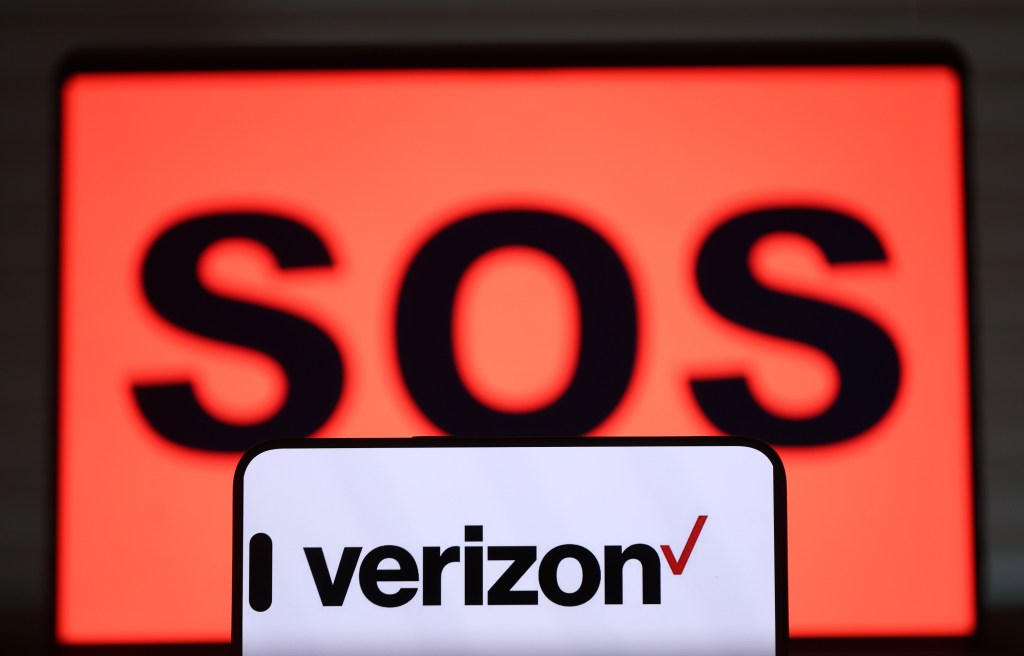The Verizon logo displayed on a smartphone screen on September 30, 2024. (Photo illustration: Justin Sullivan/Getty Images)