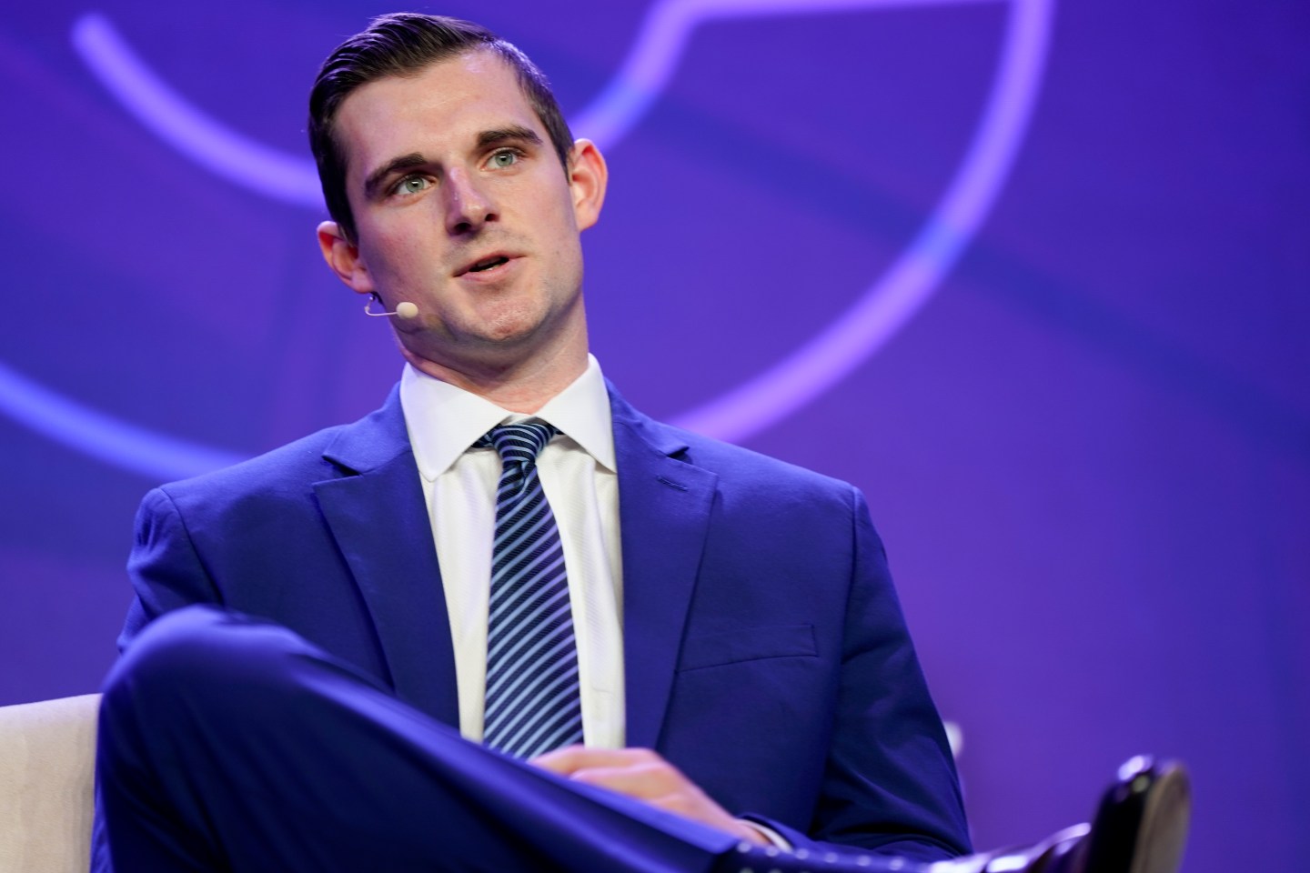 man speaks at conference