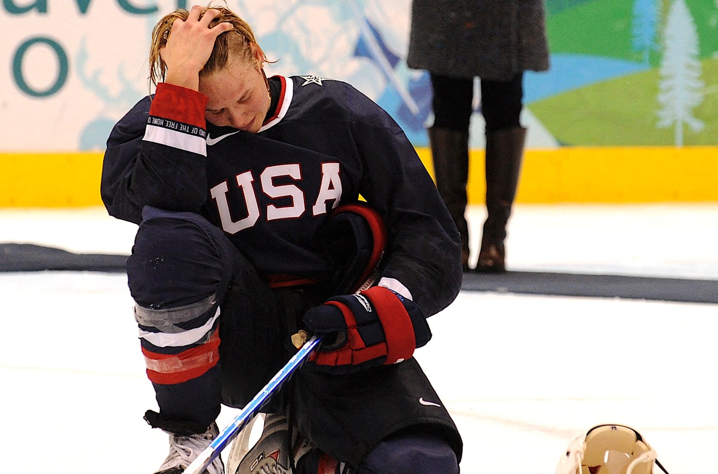 Photo: A member of the USA team cries during the medals ceremony following their loss against Canada to win the Silver in the Women's Gold Medal Hockey game at the Canada Hockey Place during the XXI Winter Olympic Games in Vancouver, Canada on February 25, 2010. Canada won 2-0 to win the gold.