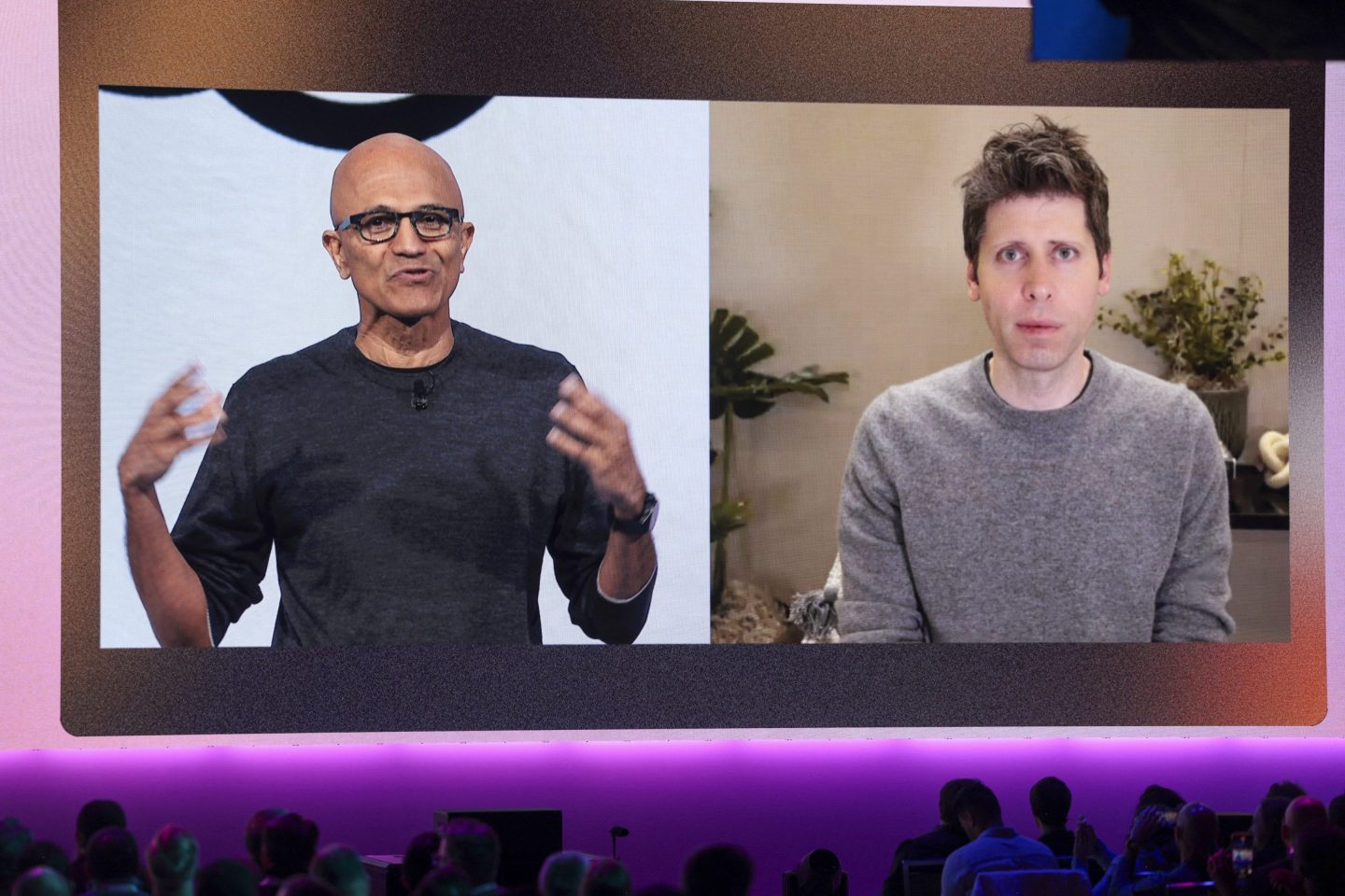 Microsoft Chairman and Chief Executive Officer Satya Nadella (L), speaks with OpenAI Chief Executive Officer Sam Altman, who joined by video during the Microsoft Build 2025, conference in Seattle, Washington on May 19, 2025.