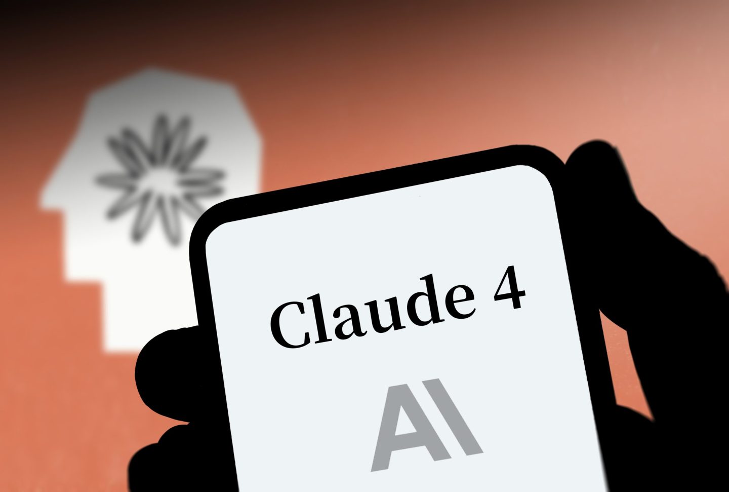 Illustration of the AI chatbot Claude on a mobile phone in front of an Anthropic logo.