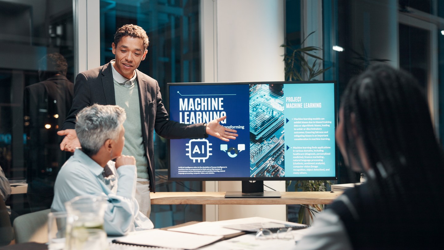 Businessman, screen and presentation in meeting for ai, machine learning or training in workshop office.