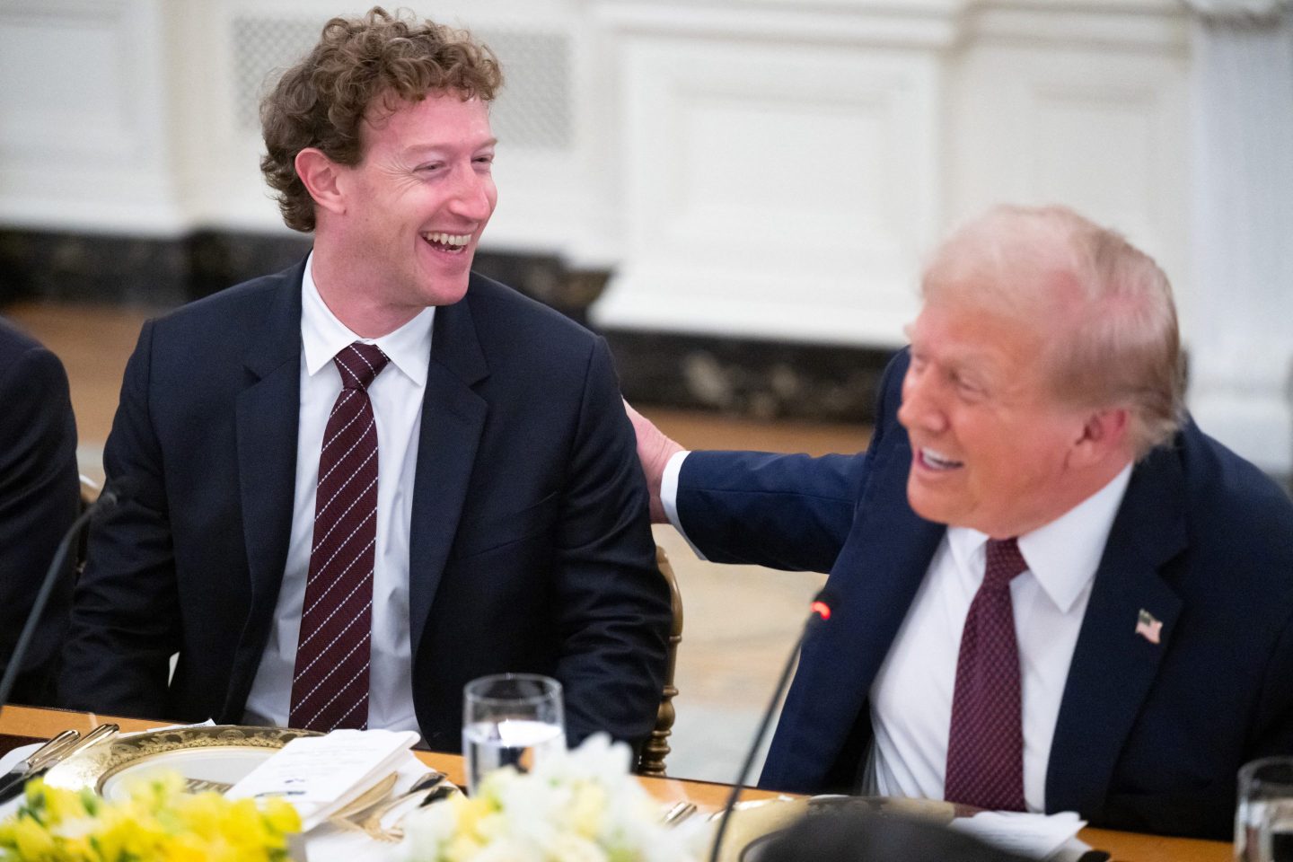 US President Donald Trump jokes with Meta CEO Mark Zuckerberg (L) as he hosts tech leaders for a dinner in the State Dining Room of the White House in Washington, DC, on September 4, 2025.