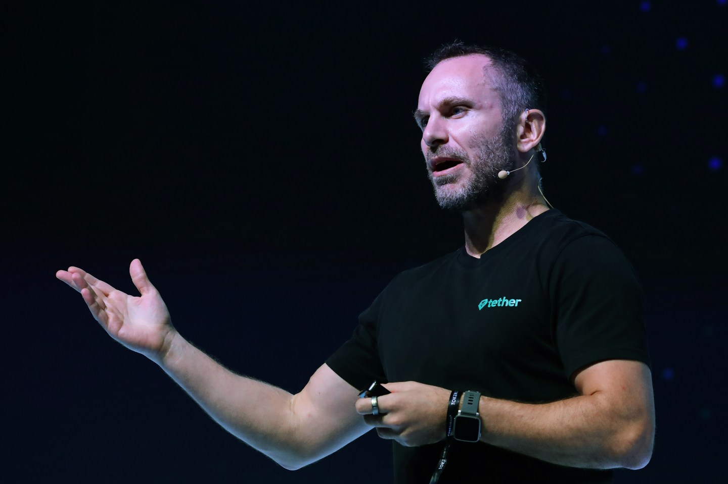 man speaks at conference