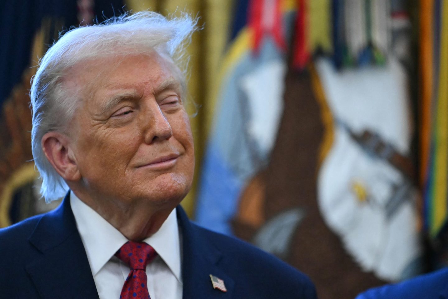 US President Donald Trump looks on during a Mexican Border Defense Medal presentation in the Oval Office of the White House in Washington, DC, on December 15, 2025. (Photo by ANDREW CABALLERO-REYNOLDS / AFP via Getty Images)