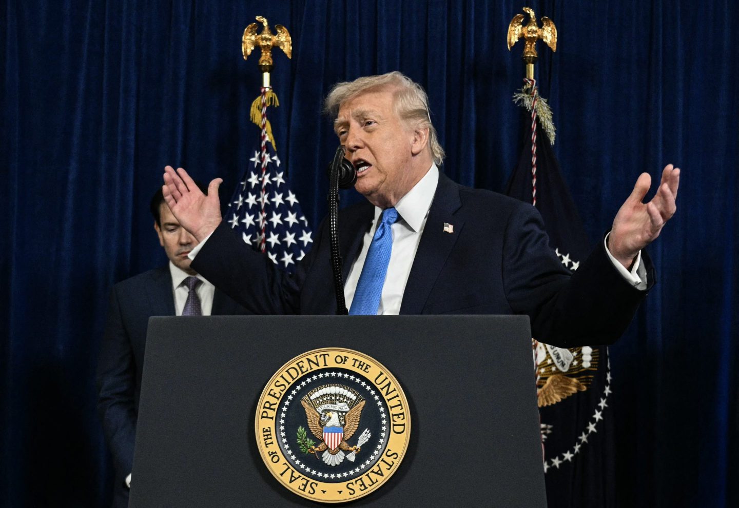 Secretary of State Marco Rubio looks on as US President Donald Trump speaks to the press following US military actions in Venezuela, at his Mar-a-Lago residence in Palm Beach, Florida.